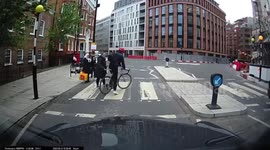 Taxi driver captures 'shocking' moment cyclist almost knocks pedestrian over after failing to stop at zebra crossing