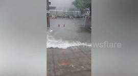 Flood submerges roads as storm batters eastern Thailand