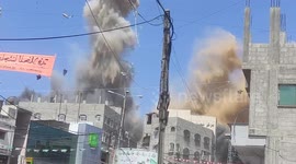 Smoke violently rises above houses in Gaza as Israel launches new airstrike