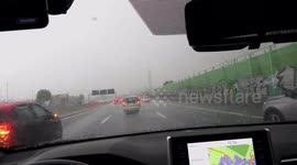 Hailstorm on turnpike near Torino Italy slows down traffic in late afternoon May 10th, 2023
