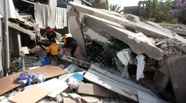 Palestinians inspect the rubble of a house after it was hit by an Israeli air strike in Gaza city.