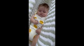 Sleeping like a baby! Heartwarming video captures newborn peacefully snoozing in family hammock outside