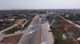 Drone footage captures tear gas shelling during PTI protest at Imran Khan's bail hearing in Islamabad, Pakistan