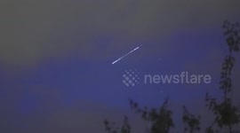 Latest Starlink satellite train pierces clouds as it ascends above Swiss Alps