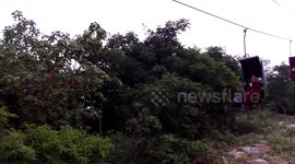 Buddhist Monks On Cableway in Rajgir India