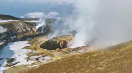 Thick smoke and lava oozes out of Mount Etna’s crater in Italy