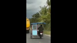 Motorcycle mishap: video captures rider's tumble on Indonesian Road