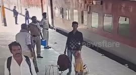 Alert cop saves life of man who slips while boarding moving train in Dehri, Bihar, India