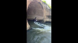 Man catches dozens of fish leaping up stream using a pitcher