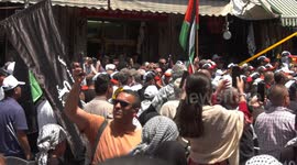 Palestinians take part in a march to mark the 75th anniversary of Nakba, or the