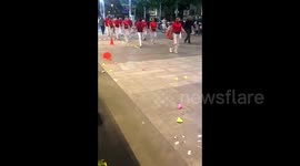 Chaos erupts as 'walking squad' breaks through barriers in children's area in China
