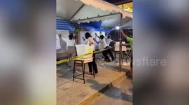 Storm blows into tents causing chaos at Bangkok polling centre