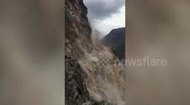 Massive landslide cascades down mountain in northern India, blocking road