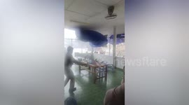 Election staff rush to protect ballots as storm batters polling precinct in northern Thailand
