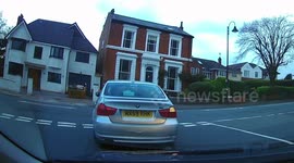 Hilarious moment BMW driver tries and fails to use their indicator signal at British junction