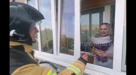Firefighter fulfils burning desire by proposing to girlfriend on balcony with help of cherry picker