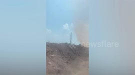 Family drives through apocalyptic-looking dust devil tornado