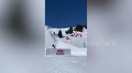 Downhill skier slams on the slops while trying a 1440 spin in Austria