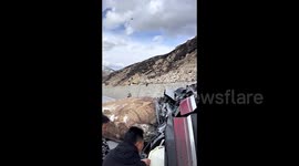 Driver narrowly escapes as giant rock hits SUV on Chinese highway