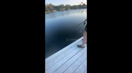 Overzealous boy sends fish FLYING into the air after pulling it too hard
