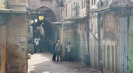 Israeli police stand guard as Jewish settlers tour in old City in Jerusalem, amid tensions ahead of the annual flag march which marks Jerusalem Day