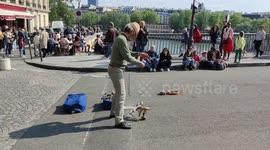 Street wooden puppet show in Paris, France, Pont Saint-Louis bridge, Notre-Dame. 18 may 2023