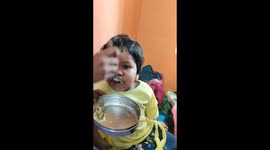 Spoon feeding by the sister in the day care center