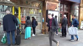 Passengers gathered outside closed Earls Court station due to fire alert