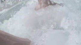 My son and I playing in the waves on Majorca