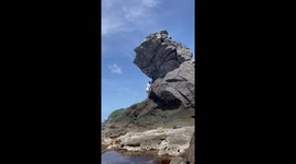 Man Climbing Rocks Falls And Injures Himself