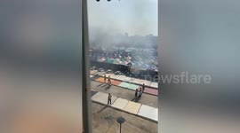 Fire rips through market stalls after fuel tank explosion