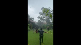 Giggling Together In The Rain