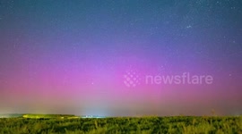 Purple and pink aurora seen shining over Netherlands north coast