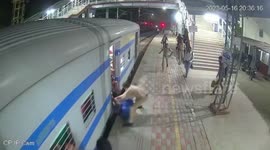 Passenger slips while boarding moving train in northern India
