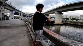Young Chinese Student's Ingenious Fishing Technique with a Mineral Water Bottle