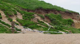 Large rock falls at East beach in Dorset, England