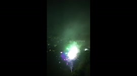 High up portrait drone view of a kings coronation firework display in Cheshire