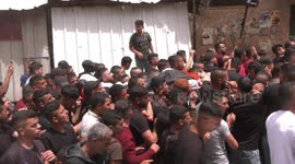 Mourners march with the bodies of Palestinians killed overnight in the Balata camp for Palestinian refugees on the outskirts of Nablus in the West Bank
