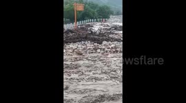 Heavy rain triggers mudslide burying bus in northern China