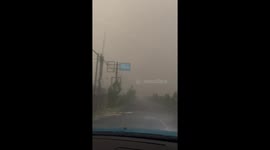 Passenger shouts as car driver tries to overtake vehicles in TERRIBLE weather
