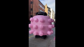 Pink inflatable mysteriously envelops phone box in London's Farringdon