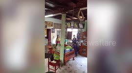 Huge 20-ft python stalking family's cat pulled from living room ceiling in Thailand