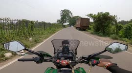 Biker's Helmet Cam Captures Close Call With Truck