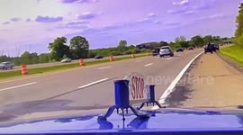 Real-life cowboy on horseback chases down and lassoes runaway cow sprinting down busy highway