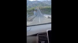 Car Rolls on Pakistan Bridge