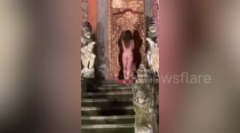 German tourist strips NAKED and gatecrashes sacred performance at temple in Indonesia