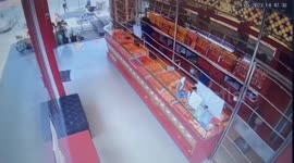 Bungling robber caught when he's locked inside gold shop by automatic doors
