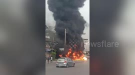 Raging fire engulfs pick-up truck loaded with paint thinner bottles next to houses in Thailand