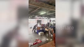 Violent storm tears through vendors' stalls at market in Thailand