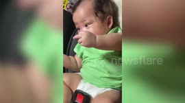 Funny baby sparks laughter when she innocently points middle finger at mum